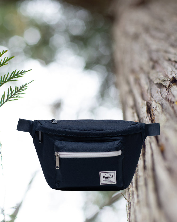 Herschel Supply Co. Pop Quiz Hip Pack in navy blue, shown from a front angle against a plain background.