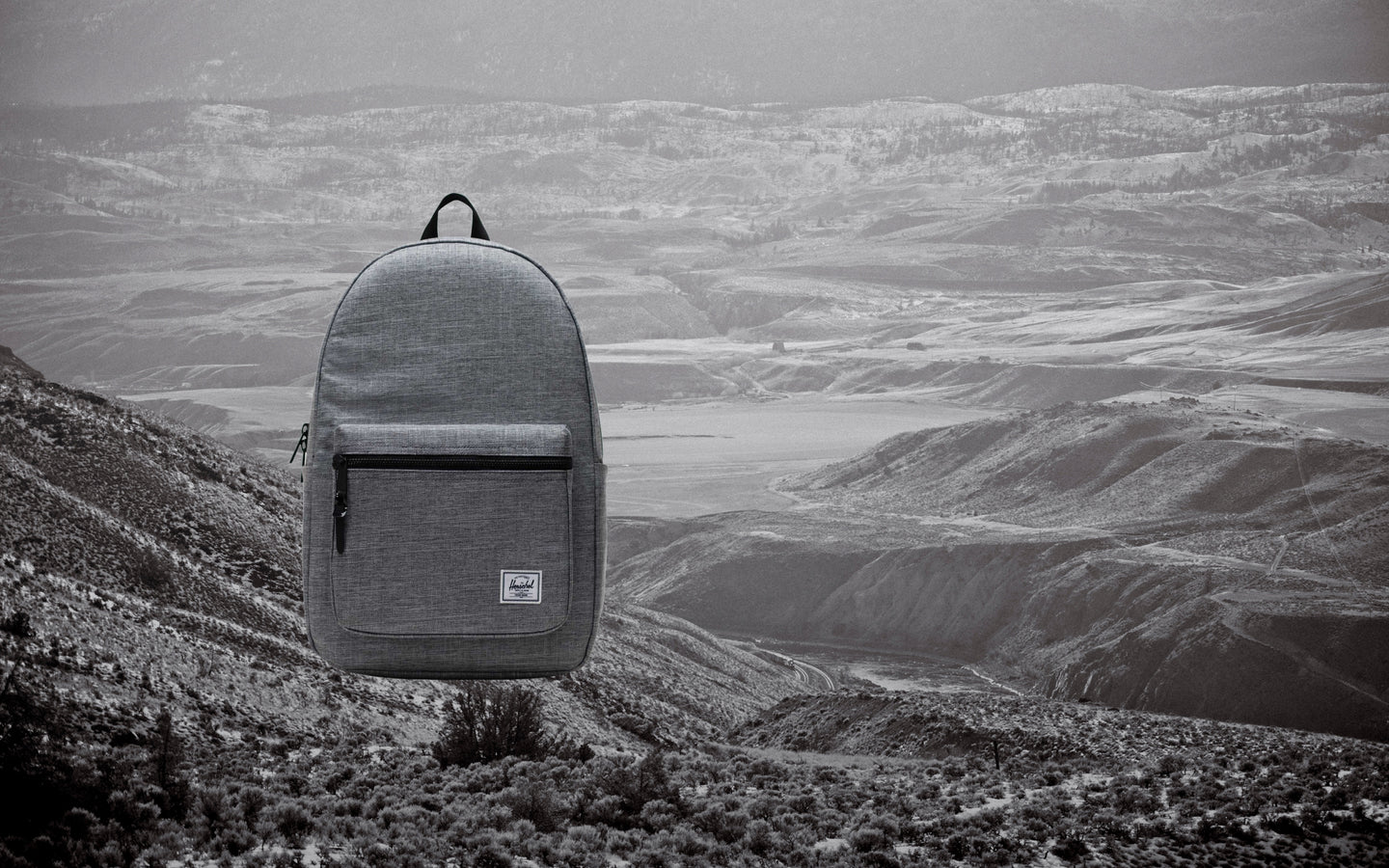 Herschel Supply Co. Settlement Backpack in Raven Crosshatch, shown from the front.