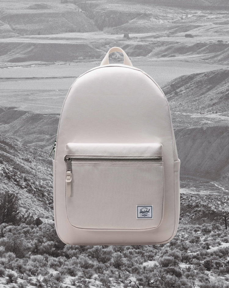 Herschel Supply Co. Settlement Backpack in Moonbeam beige colorway, shown from the front as a mobile hero image.