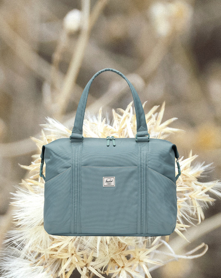 Herschel Supply Co. Strand Duffle Diaper Bag hero shot, showing the front view of the bag.
