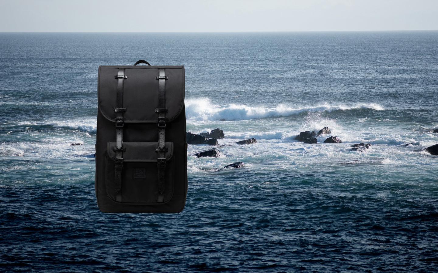 Herschel Little America Backpack in black, showing the classic mountaineering style with dual strap closures.
