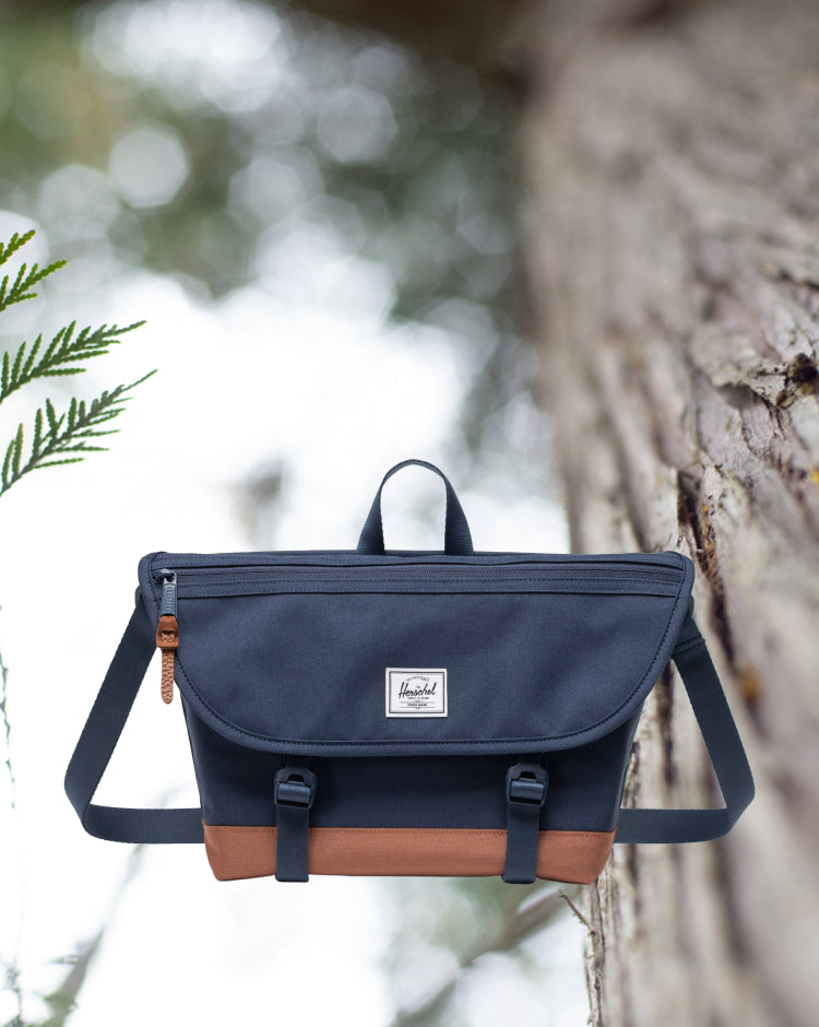 Herschel Supply Co Cove Small Messenger bag in Navy and Saddle Brown.