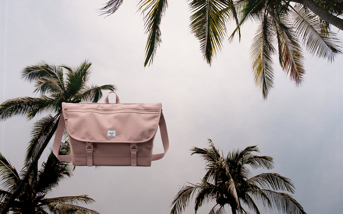 Herschel Supply Co. Cove Messenger bag in Ash Rose, shown in a desktop hero view.