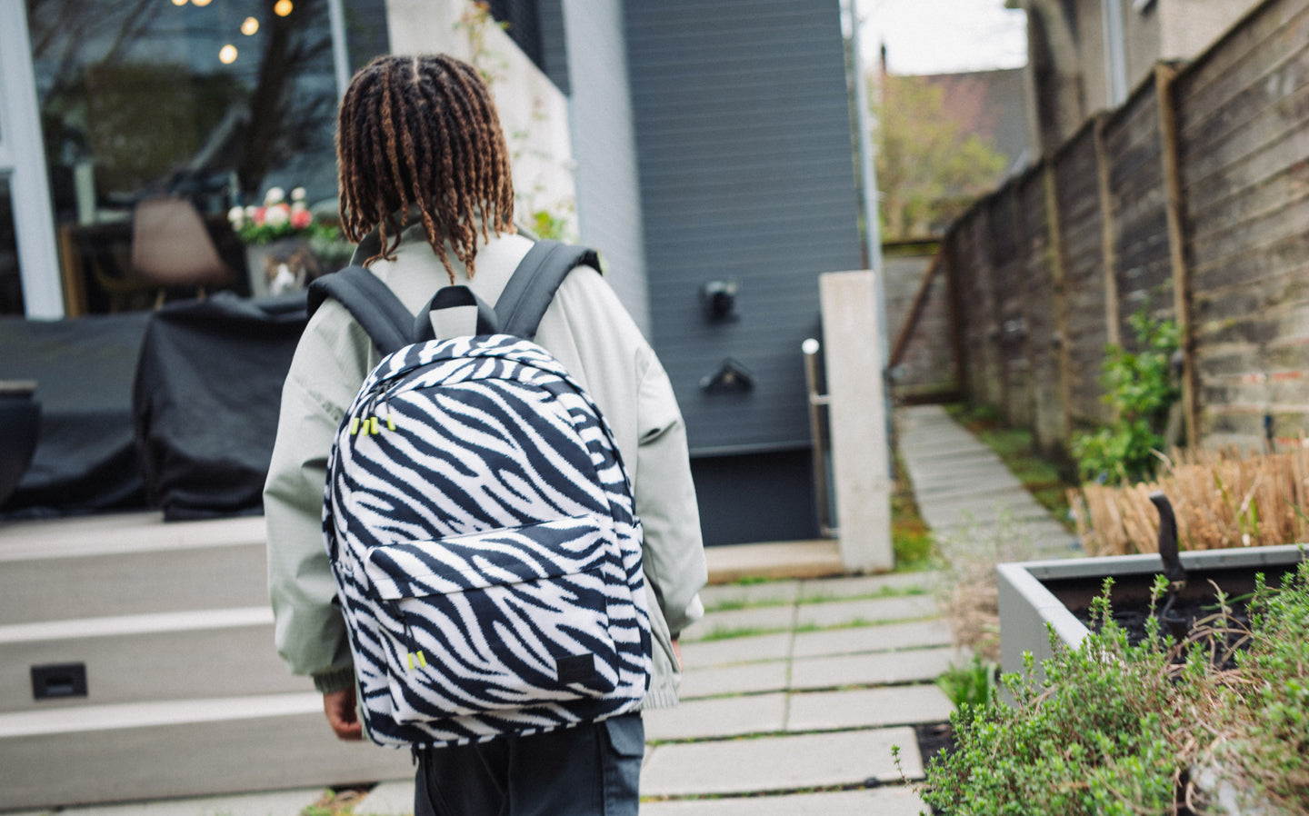 Herschel Classic Backpack in Zebra print, showing a classic backpack design with a black and white zebra stripe pattern.