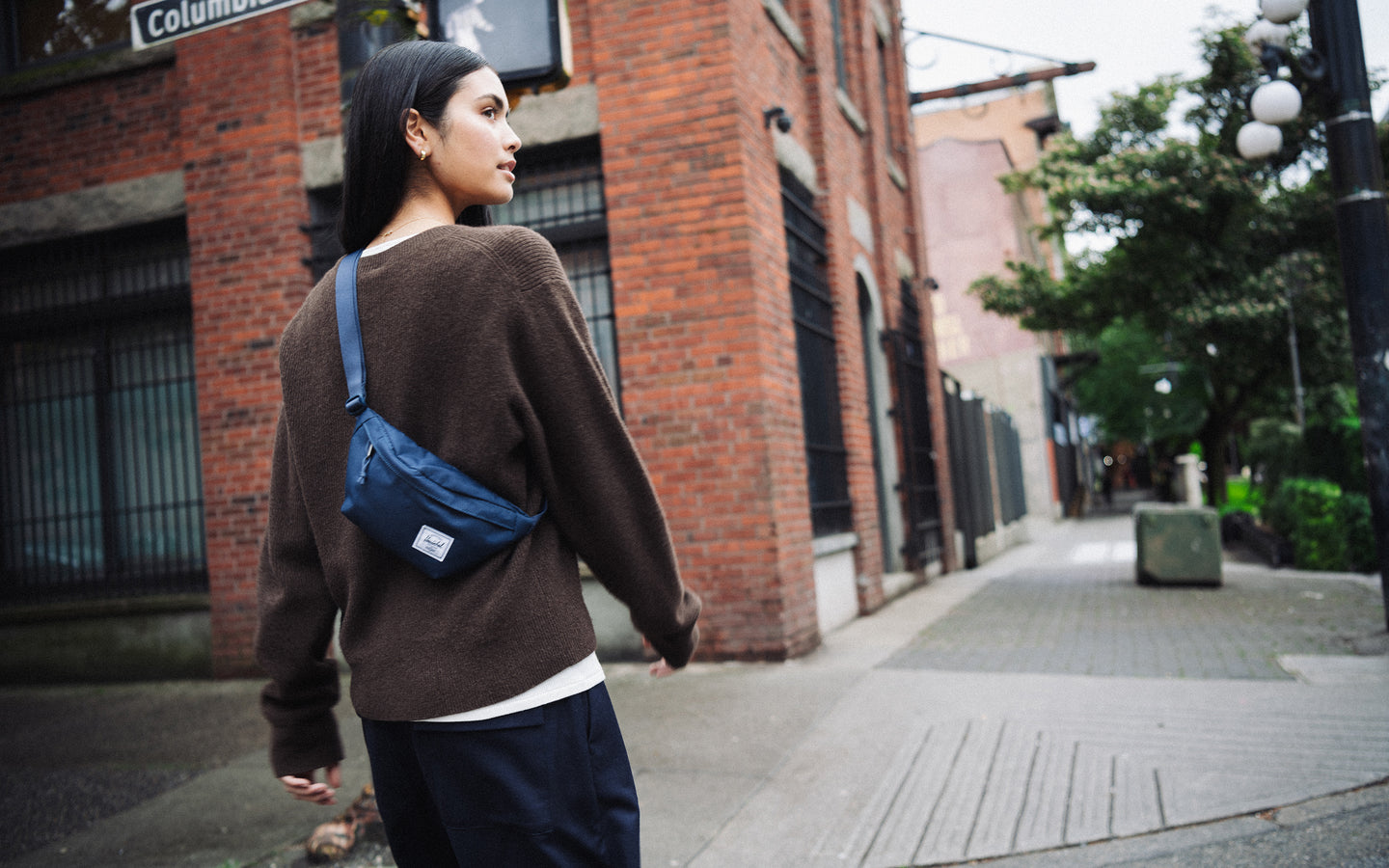 Herschel Supply Co. Navy Classic Hip Pack shown from the front with a zippered closure and an adjustable webbing strap.