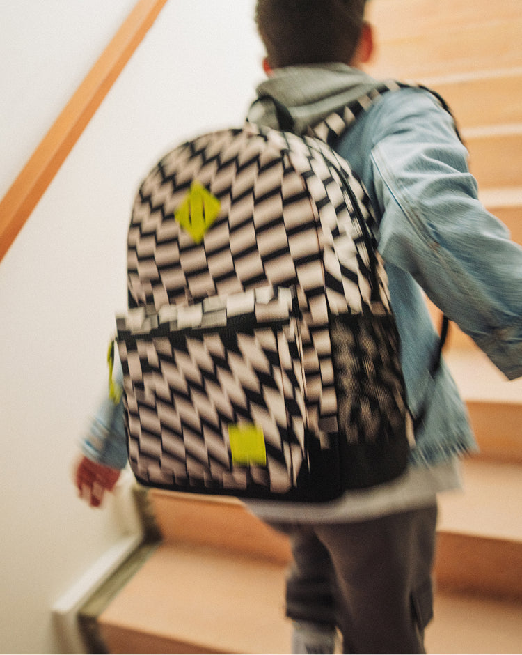 Herschel Heritage Youth Backpack in Warp Check pattern, featuring a black and white checkerboard design with a diamond accent.
