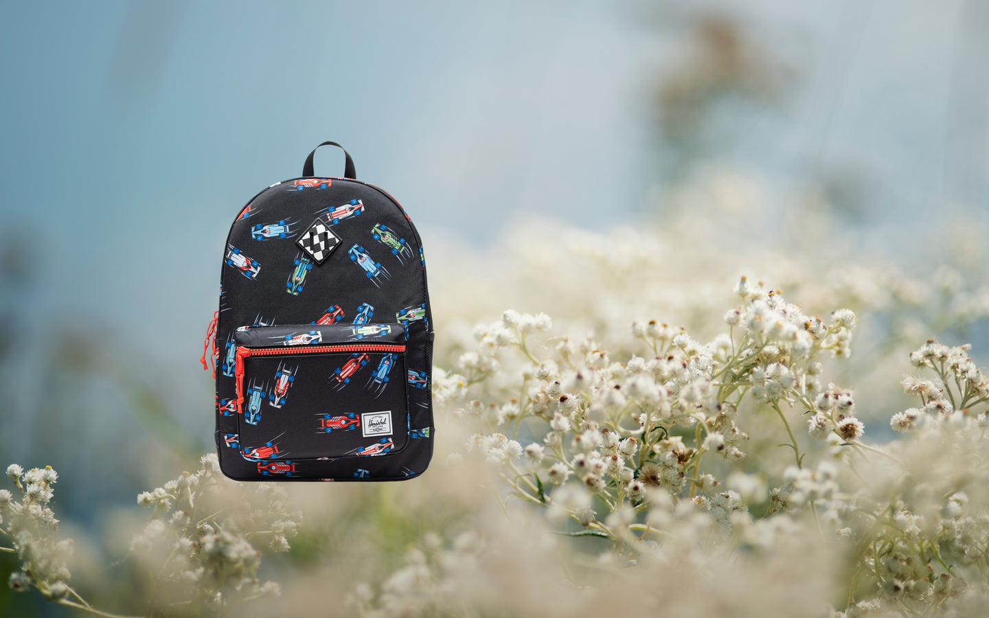 Herschel Heritage Youth Backpack in Race Cars color pattern.