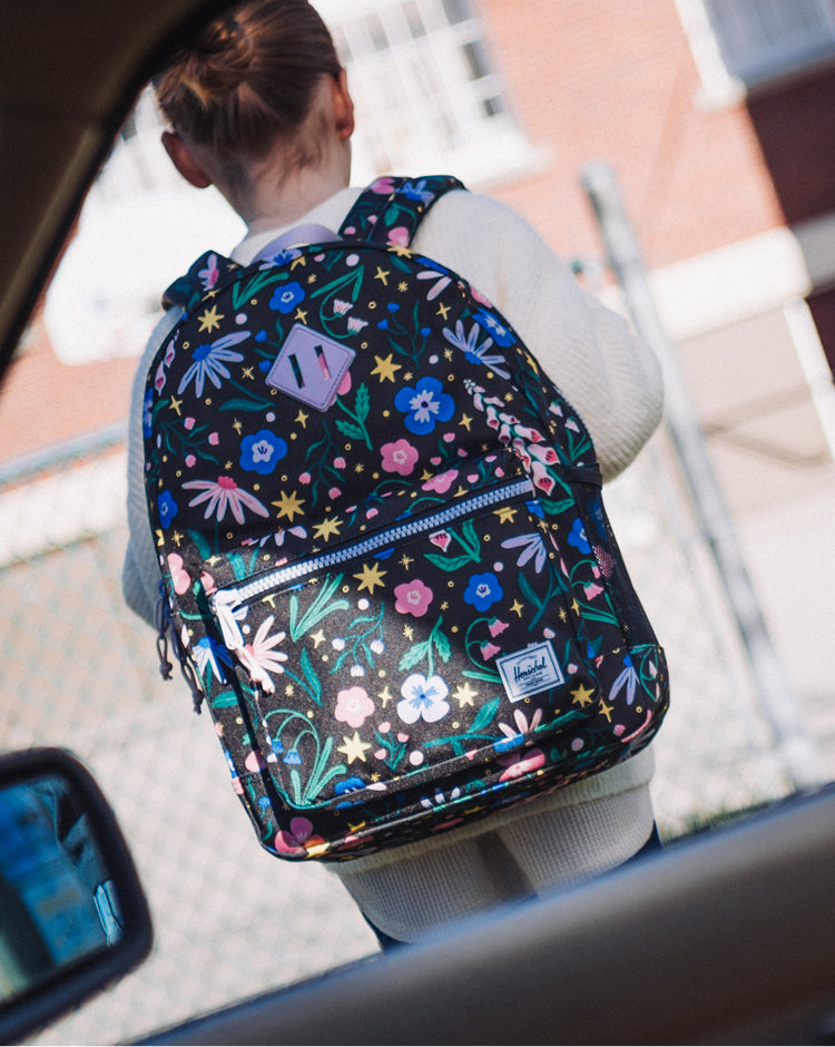 Herschel Heritage Youth Backpack in Enchanted Garden floral print.