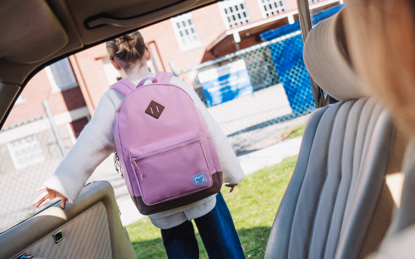 Herschel Supply Co. Herschel Heritage Youth Backpack in Cashmere Rose pink and Saddle Brown, shown as a desktop hero banner.