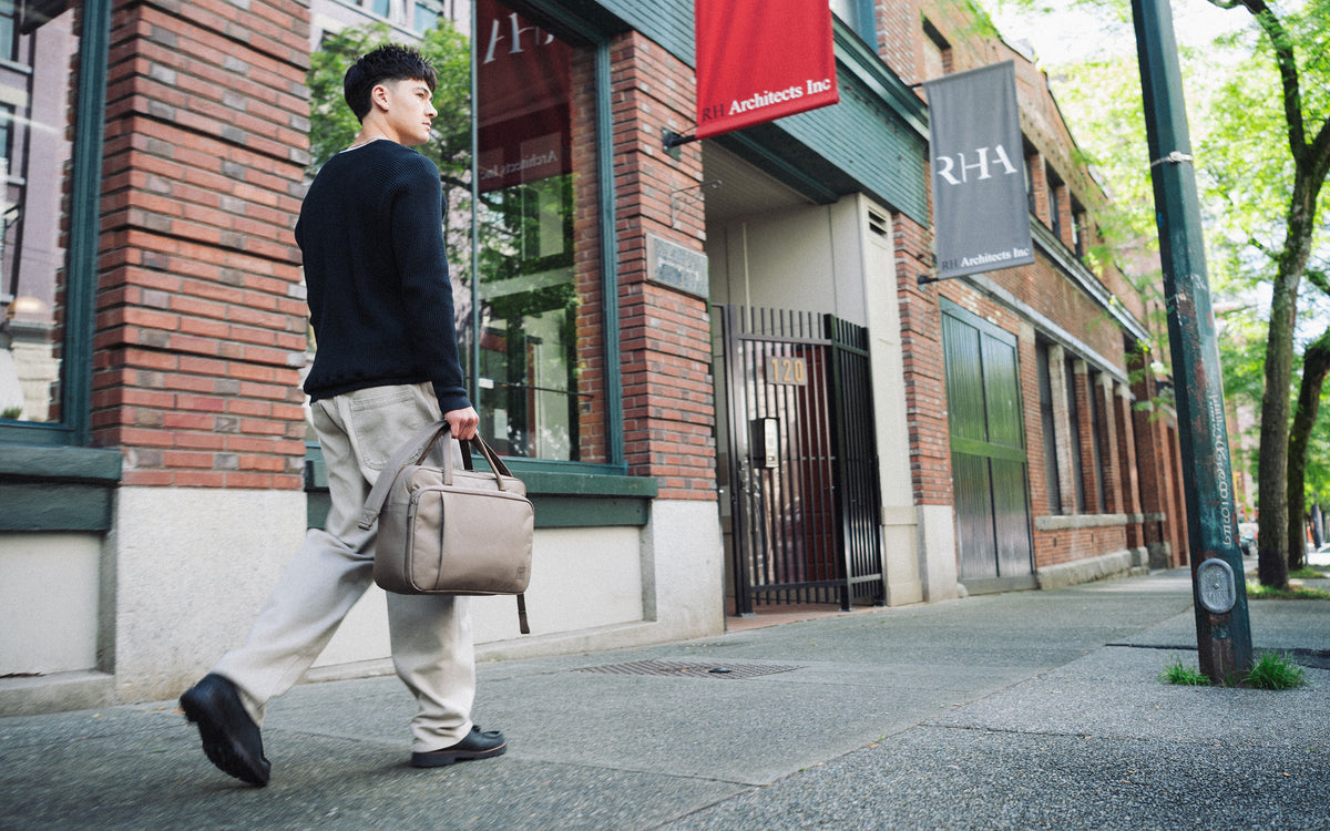 Herschel Supply Co. Gibson Messenger Tech bag in light brown, shown as a hero image for desktop.