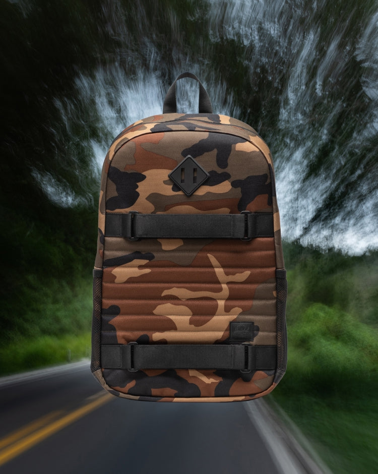 Herschel Supply Co. Fleet Skate Backpack in Woodland Camo/Black shown from a front lifestyle mobile view.
