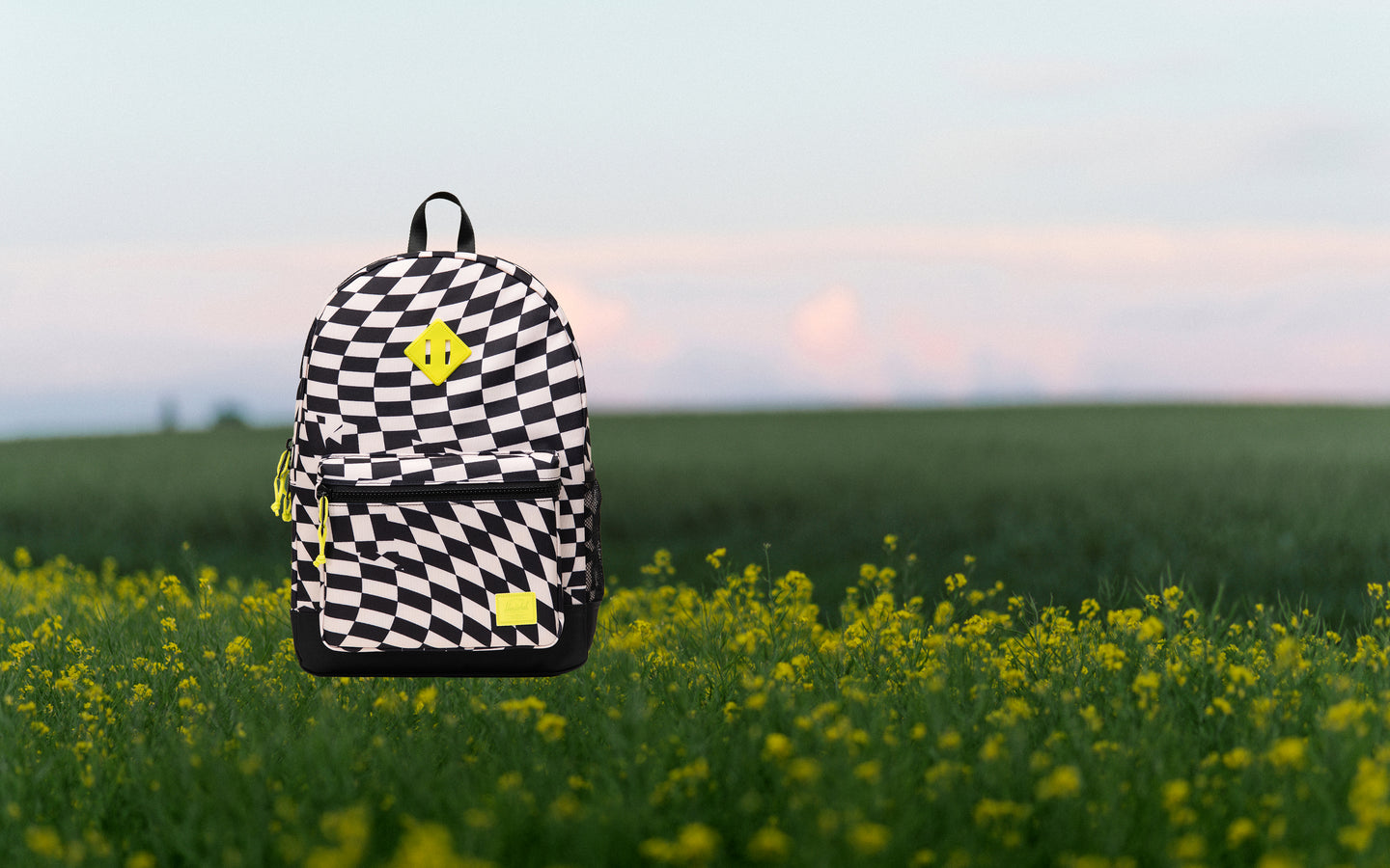 Herschel Supply Co. Herschel Heritage Kids Backpack in Warp Check pattern, featuring a black and white distorted checkerboard design.