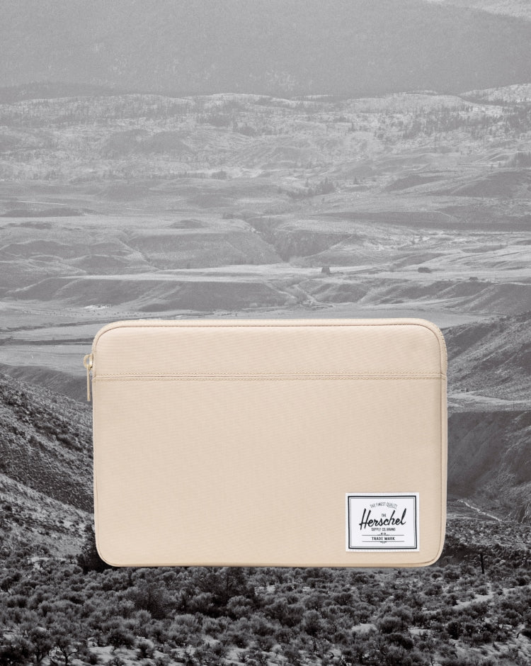 Herschel Supply Co. Anchor 14 Inch Sleeve in Eucalyptus green shown from the front against a clean background.