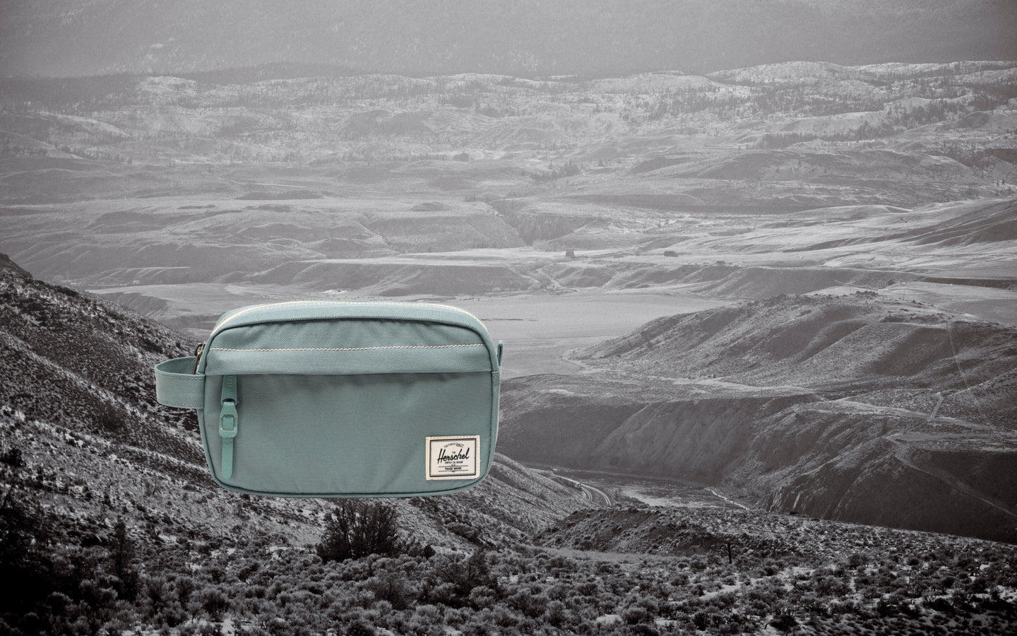 Herschel Supply Co. Chapter Small Travel Kit in a camouflage pattern shown on a clean, light gray background.