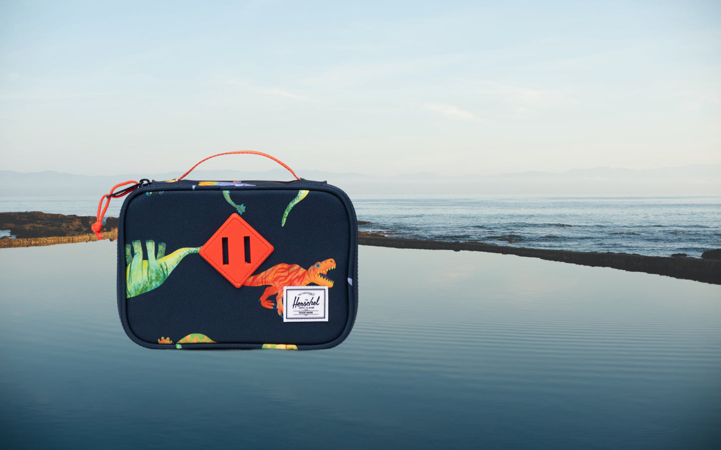 Herschel Heritage Pencil Case Little Herschel in Water Colour Dinosaurs Darkest Navy, featuring a colorful dinosaur pattern on a dark navy base.