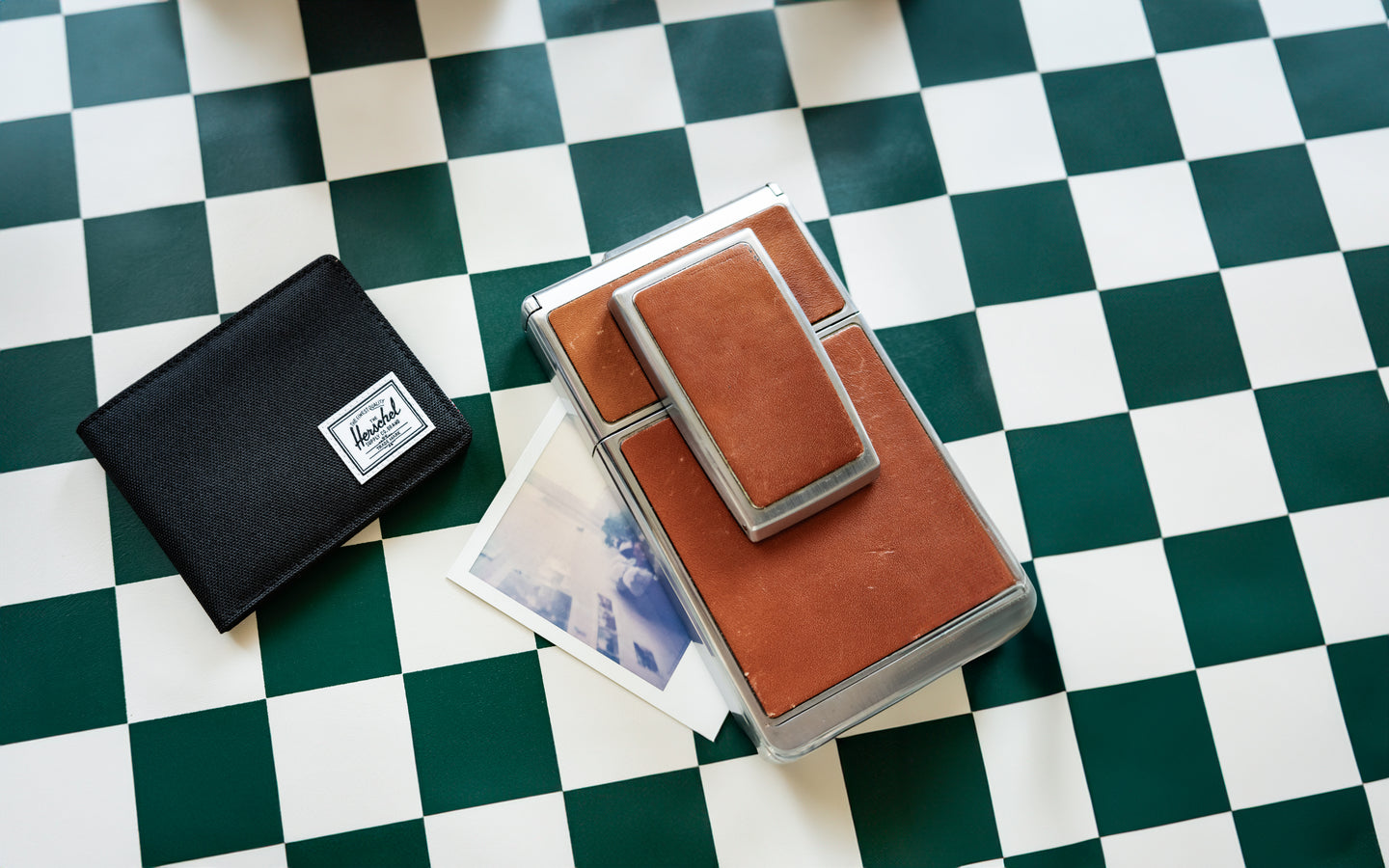 Herschel Supply Co. classic Roy Wallet in solid black, displaying its sleek bi-fold design and iconic woven label.