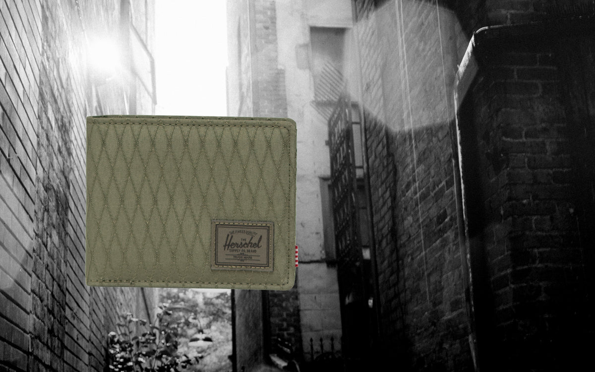 Herschel Supply Co. Roy Wallet in Ivy Green Diamond, featuring a classic bi-fold design with a textured diamond pattern.