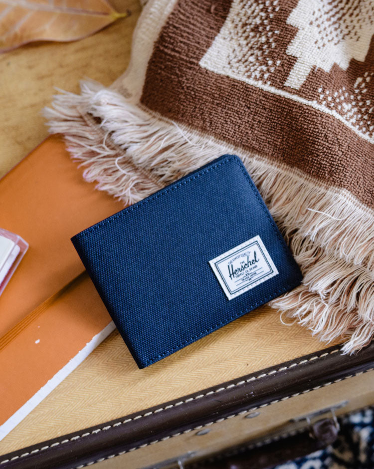 Navy blue Herschel Supply Co. Roy Coin Wallet featuring a classic bifold design.