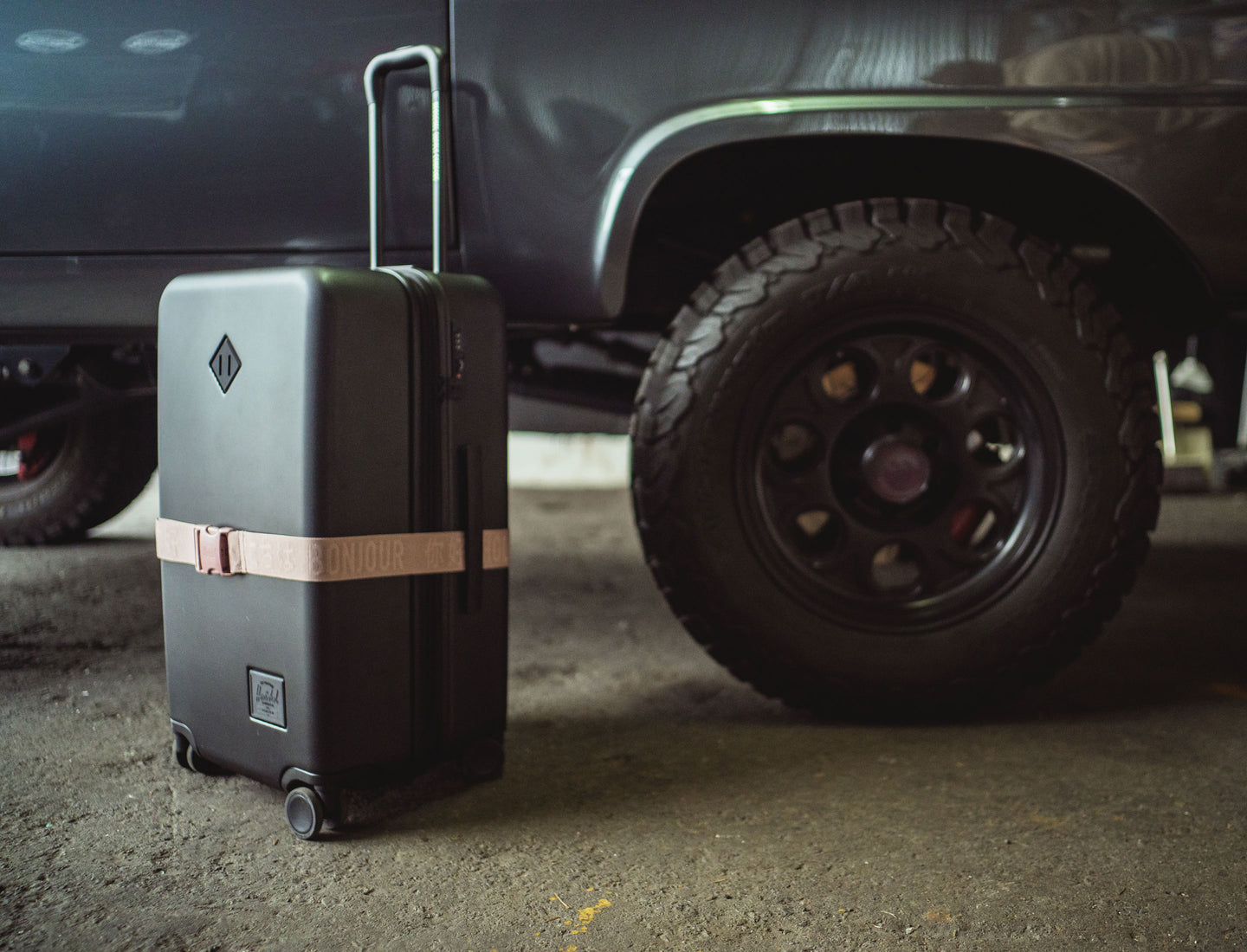 Herschel Supply Co. Luggage Belt in Ash Rose displayed on a desktop background.
