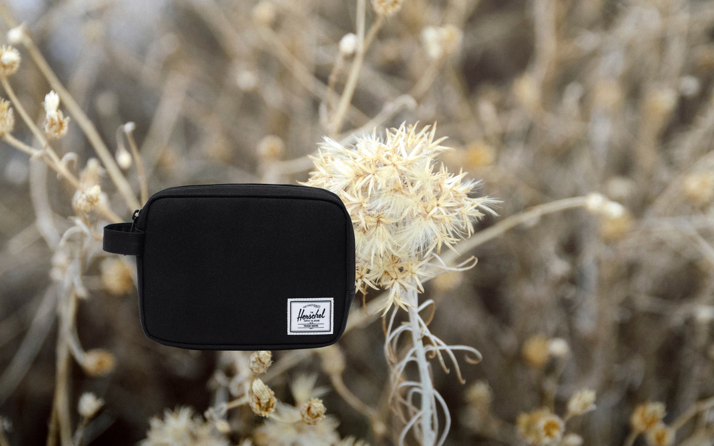 Herschel Supply Co. Anchor Organizer in solid black, a sleek and durable tech pouch designed to securely store and organize daily essentials.