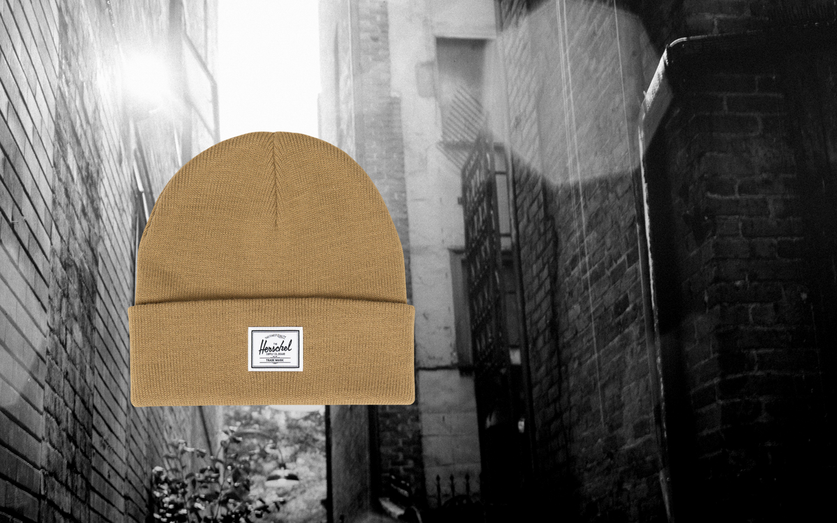 Herschel Supply Co. Elmer Beanie in Antique Bronze, a knit cuff beanie hat shown on a plain background.