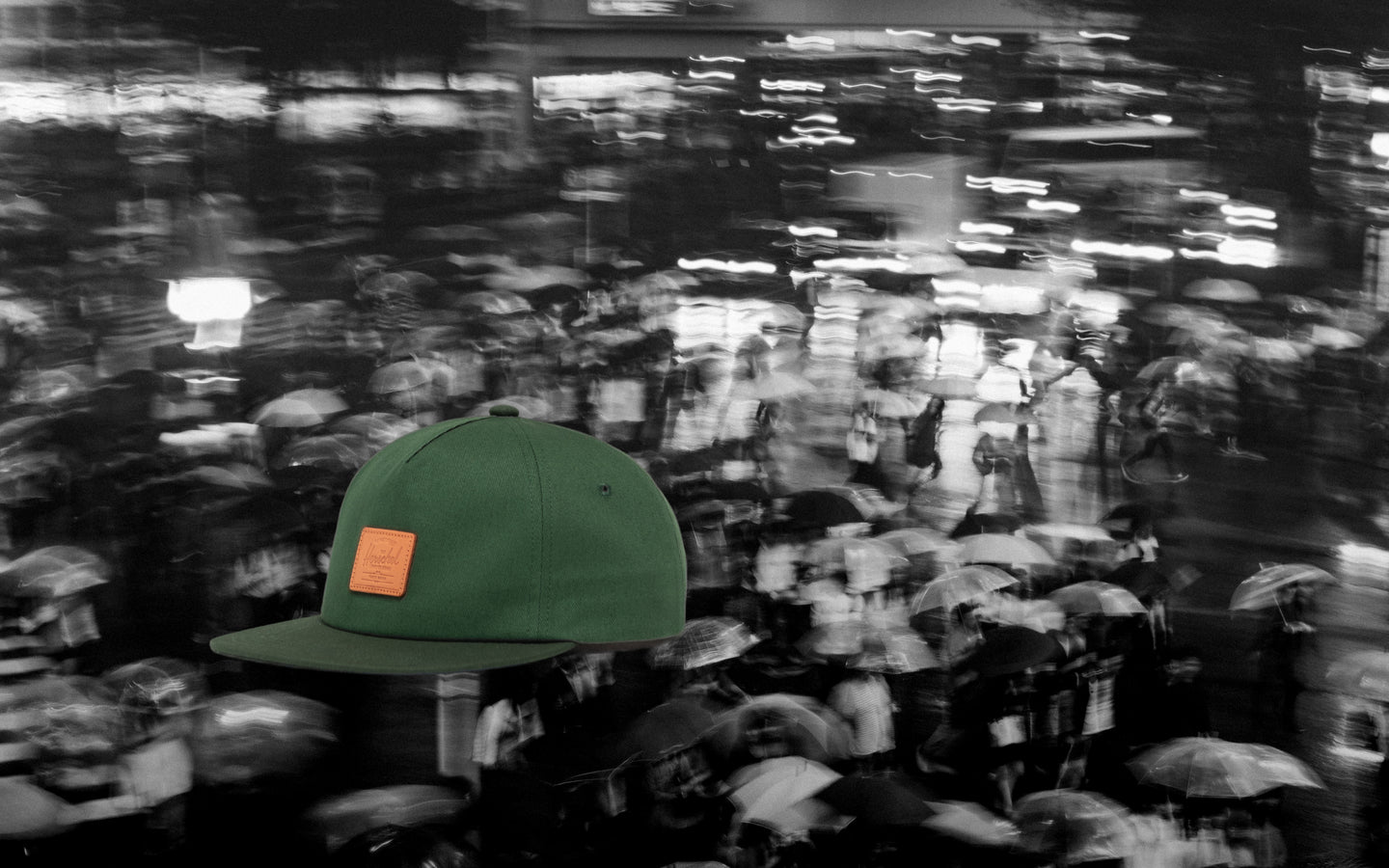 Herschel Supply Co. Scout Vintage Cap in Dark Green/Mountain View, displayed on a desktop lifestyle background.