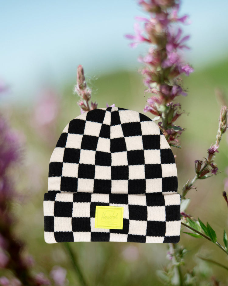Herschel Supply Co. Elmer Kids Graphic Beanie featuring a classic black and white checkerboard knit pattern.