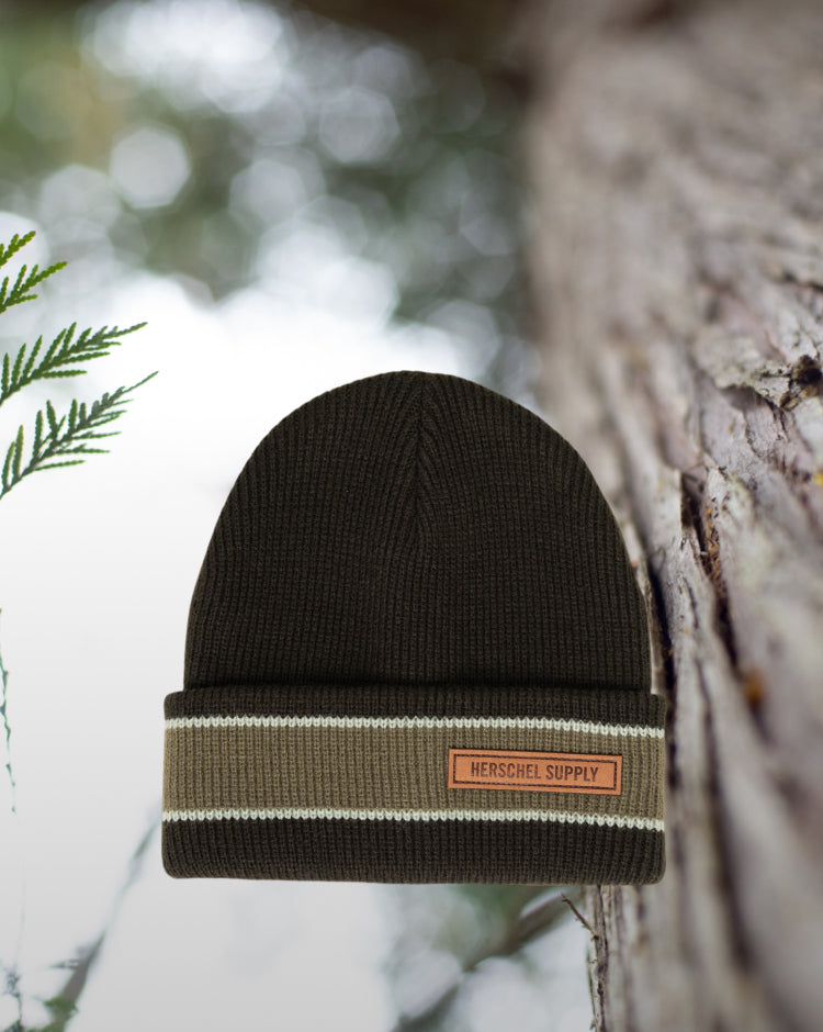 Herschel Supply Co. Elmer Ribbed Vintage Stripe beanie in Rosin green with a folded cuff and classic woven label.