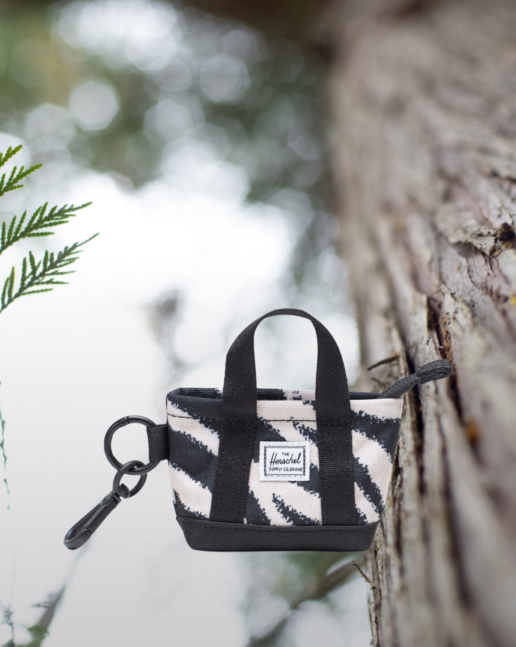 Herschel Supply Co. Herschel Heritage Tote Bag Charm in a black and white zebra print pattern.