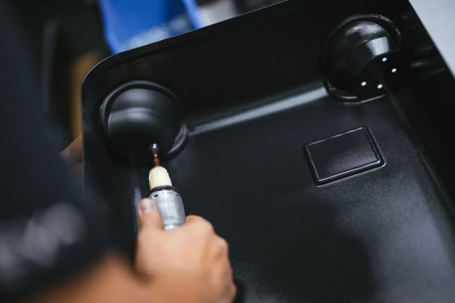 An image of the Hinomoto wheels being installed on the Herschel Heritage Hardshell luggage.