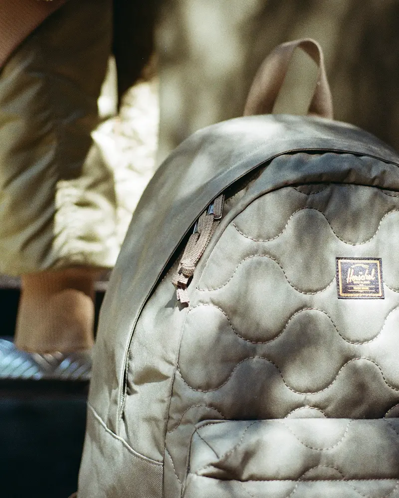 A photo of the Herschel Heritage Backpack in Beetle from the new Quilted Capsule Collection.